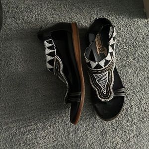 Woman’s sandals black and white, gold trim